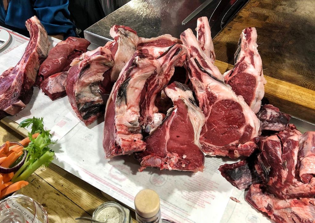 raw florentine steaks before being grilled