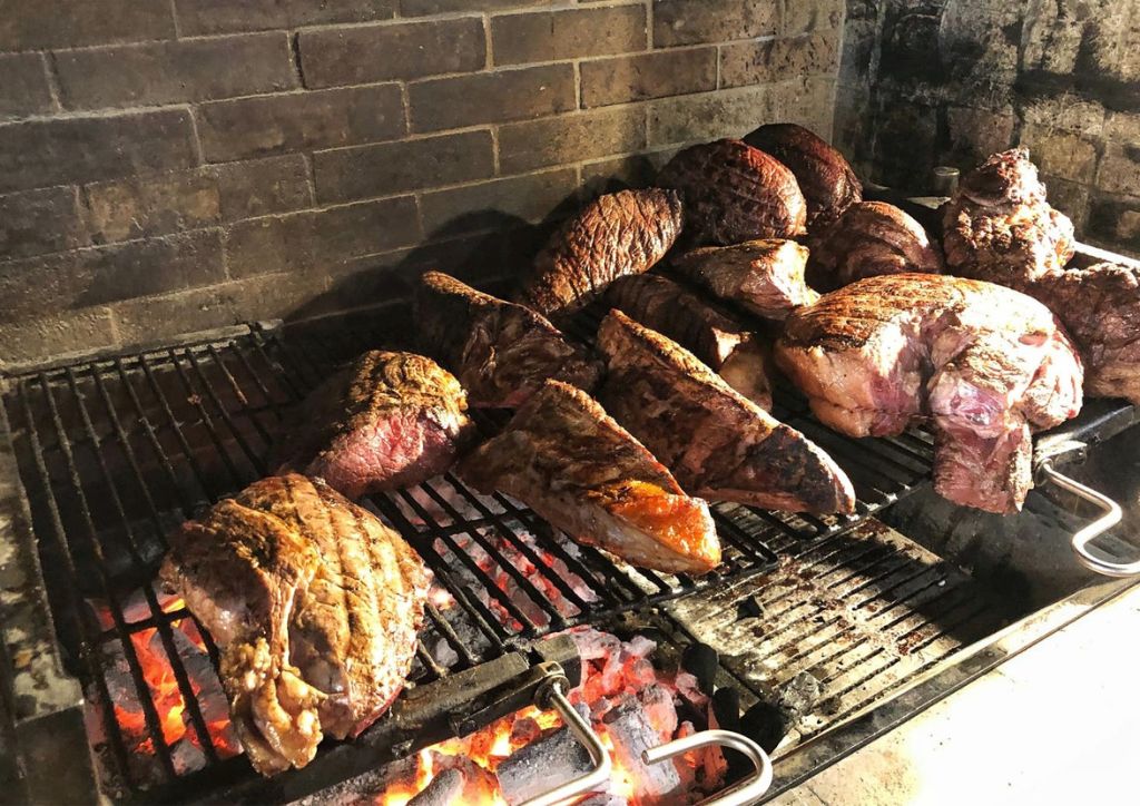 meat and florentine steaks on the grill