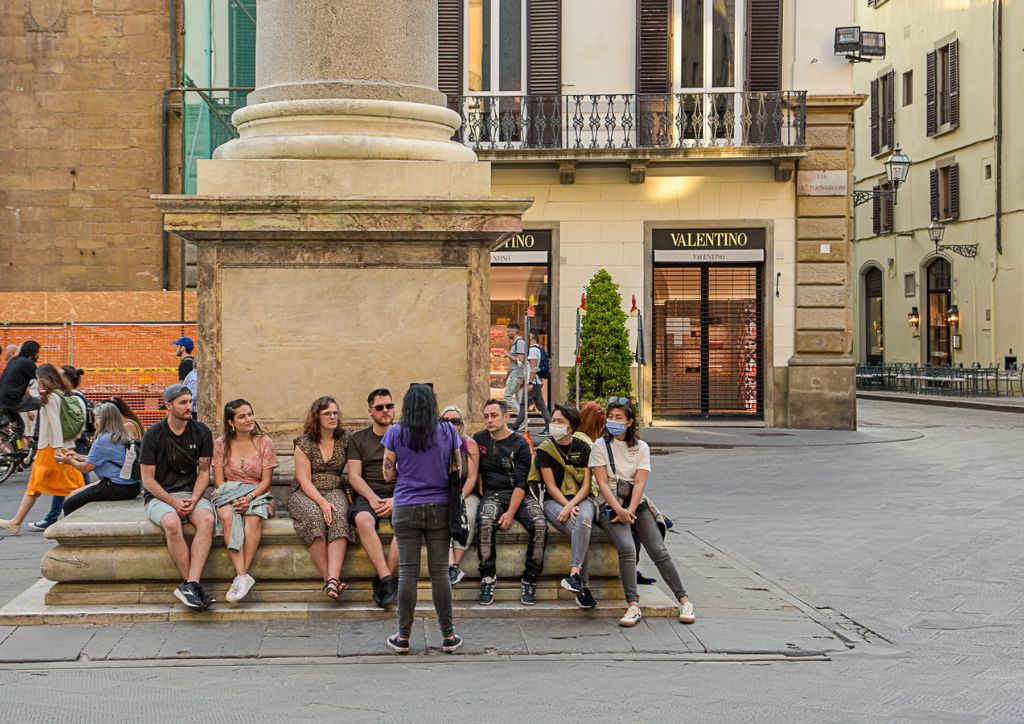 people taking a walking tour in florence, italy