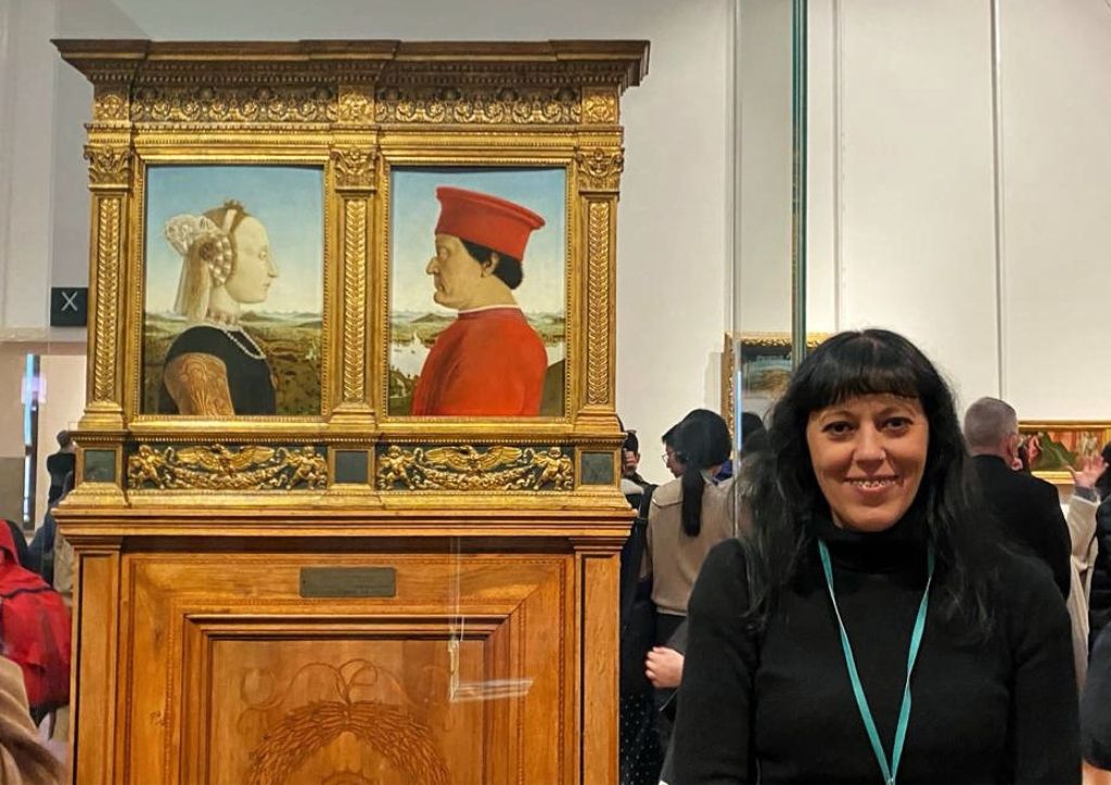 Uffizi gallery tour guide with a painting by piero della francesca