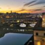 sunset over the Arno river seen from the window of the Uffizi gallery