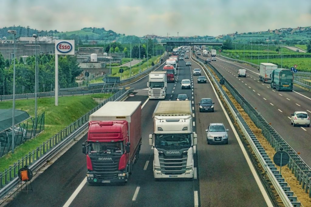 italian autostrada with trucks and cars
